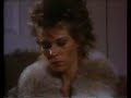 Linda Elder's wonderfully cool and quiet The Woman carries out two more silencer-wielding hits, first posing as a hooker in a bar to lure her mark to a discreet bedroom, and then taking out another guy in his kitchen. From the film 