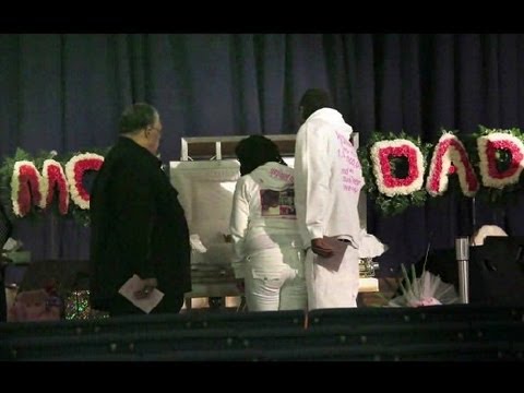 funeral - Jonylah Watkins looked like a life-sized baby-doll. Her mother, Judy Watkins, picked a petal pink coverall to lay her baby to rest. The baby was placed in a ...