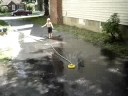 Nicholas playing in sprinkler
