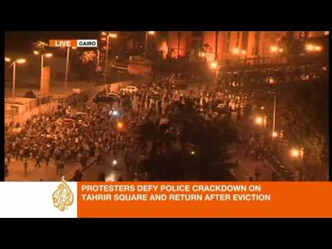 tahrir tents - Egyptian soldiers and police set fire to tents in the middle of Cairo's Tahrir Square and fired tear gas and rubber bullets in a major assault on Sunday to d...