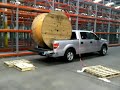 no forklift? no problem- comm techs getting the job done no matter what! reel of innerduct offloaded using cave man technology