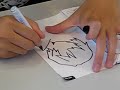 A Gainax animator whose name I forgot drawing a sketch of Ayanami Rei at the German Connichi anime convention 2008 in Kassel. Quite interesting to observe the technique, so I filmed it all. Sitting around him are other Gainax staff members, including co-founder Akai Takami, Gurren Lagann chara designer Nishigori Atsushi, Gurren Lagann producer and Gainax co-founder Yamaga Hiroyuki, and others.