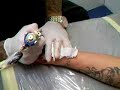 Tattoo T-Bear ? tattooing brian on his hand Tattoo T-Bear ? tattooing brian on his hand