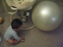 Baby Playing with Giant Ball