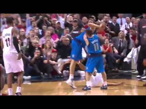 Game 4: Andre Miller and Dirk Nowitzki fight for the ball