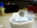 magnet suspended by superconductor in liquid nitrogen