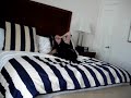 Me jumping in the bed of The Ritz Carlton Hotel