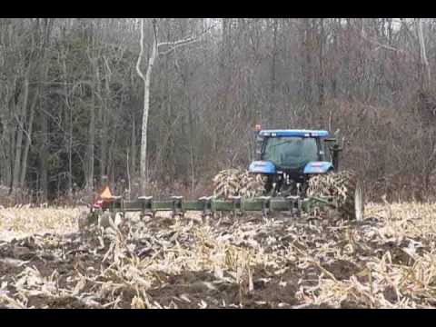T7060 - http://www.cedarlodgefarms.com Setting up our 7 furrow plow to be pulled by our T7060.