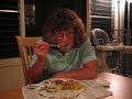 Mom falls alseep while eating.