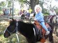 Maggie riding the pony