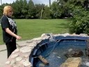 Wyonna throws a dime into Englehart fountain