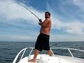 my father and i were shark fishing off the coast of montauk. lots of sharks were caught and released. this smaller blue shark (approx 75lbs) was hanging out in the slick. it would of been no contest catching him on out shark gear (penn 50s 2-speed, lamiglas 5650 cpo) so i decided to try my luck with my bluefishing rod ( daiwa dforce #dwd-701mhbws, shimano 3500b baitrunner spooled with ande 15# test gray, and a standard bluefish hook w/ 6'' wire leader). so after a 45 min fight, almost getting spooled twice, i told my dad to break out the camera and take a flick of my catch. he couldn't believe it when i got the fish to the boat. he thought i was either going to break my rod or get spooled. to say the least it was the best fight i had to date (besides a few makos and tuna) and was a blast getting it to the boat. the barb of my hook was in the eye of another hook that was already in the sharks mouth. o, and my pops isn't good with a camera so i had to coach him a little.... enjoy