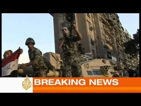 jazira - Thousands of Egyptians continue to hold protests on Cairo streets in defiance of a nationwide curfew. In a desperate attempt to restore order, an army officer was seen getting on top of an armoured vehicle to address a crowd of protesters.