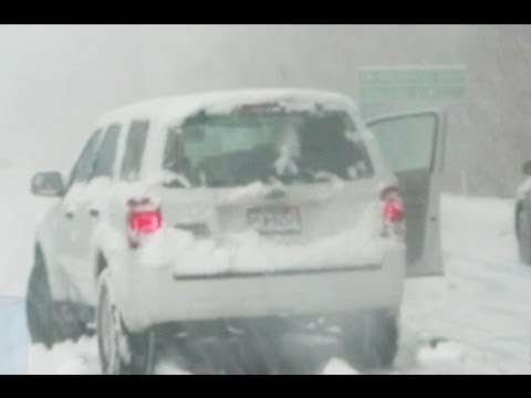 weather - Ice and up to a foot of snow cause highway rescues and deadly accidents.