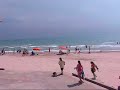 Calm Before the Storm: Despite Erin, people play on beach
