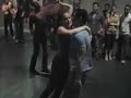 new swing sextet plays live while jason molina of puerto rico social salsa dances with jennifer aucoin of toronto. burju of hacha y machete and friend dance in foreground at 2006 congress.