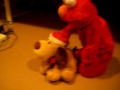 Elmo giving Mr. Jingles a wiggle