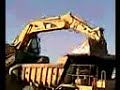 CAT 325D in CAT 769C