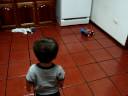 Playing with his car