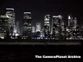 WTC memorial lights from across east river, ferry goes by