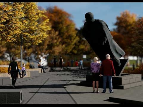 View of Memorial site featuring a large statue of Vladimir Lenin that appears to be toppling forward.