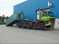 Hyvalift 40 Tons Hookloader on GINAF 10x4 lifting a heavy container