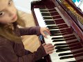 Girl playing the three Burrows on piano