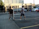 Angus and Mike interact with a parking sign.