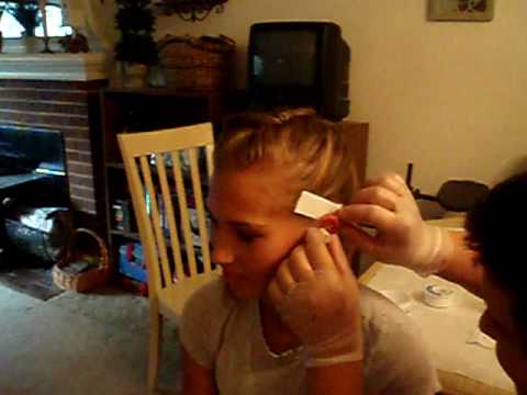 Getting an Industrial Piercing. my sister getting an industial piercing