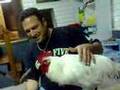 Norm with his pet rooster feeding it kefta,potatoe & chicken