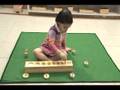 child with cylinder blocks
