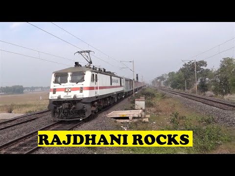 Howrah Rajdhani - Closely behind Sealdah Rajdhani, India's 1st Rajdhani and 2nd fastest Rajdhani, front panto WAP7 21 coach 12302 Howrah Rajdhani comes whining through the mor...