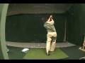 Kimo swinging 6-iron left-handed
