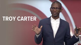Photo of Troy Carter speaking