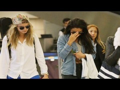 Return - Selena Gomez Slammed with Justin Bieber Questions on her Return to LA. Selena Gomez returned to Los Angeles with international supermodel Cara Delevingne, at LAX. Selena showed off her abs,...