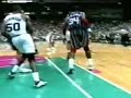 Hakeem Olajuwon blocks Tim Duncan