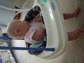 in her bouncy seat