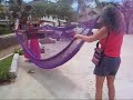 The hammock vendors can always be found near the beach in Puerto Escondido on the coast of Oaxaca in southern Mexico. In the colorful traditional clothing of their home town   Juchitan, the ladies walk all day with their hammock inventory stacked on their head. These traditional hammocks are hand made. They come in various colors and sizes. Some are made of cotton thread others of nylon thread.