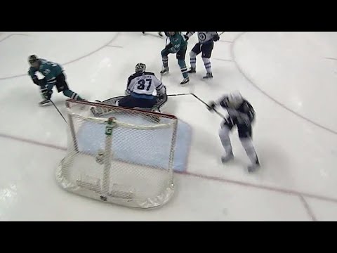 Video: Sharks' Couture slides the puck around Hellebuyck shorthanded