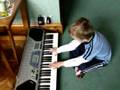 Triplet playing the keyboard