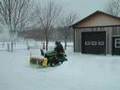 John Deere X300 with 44 snowblower in action