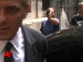 there were chaotic scenes at a courthouse in milan friday as fans and onlookers thronged to get a glimpse of movie star george clooney, there to testify in a fraud trial. (july 16)