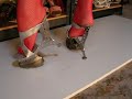 posing in unique 7 inch high heel made from all steel construction.... really unusual shank-less silver mule.... worn with red fish net stockings!