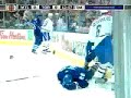Tom Kostopoulos tackles Mike Van Ryn
