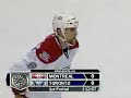 Tom Kostopoulos tackles Mike Van Ryn