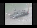 We are used to rainstorms during the South Florida summers, but this is just freaking ridiculous. There is a Jeep stuck across the street, cars driving on the crown of the road and a woman wading her way into the trunk of her Bimmer. She was hesitant to open the doors, and with good reason. Personally we though the engine in her 3 Series would be hydro locked for sure, but German engineering surprised us once again.