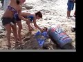 beer-bong-on-the-beach-buried-up-to-neck.html