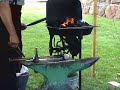 Blacksmith creating a wall hook