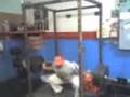 405lb partial squats with atrocious form.  Viewer beware!