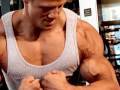 Ripped natural bodybuilder Justin Wilcox poses